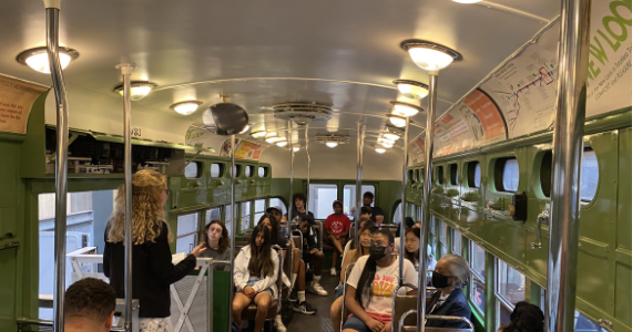 Participants learn about public transportation in Philadelphia in one of SEPTA’s retired trolleys
